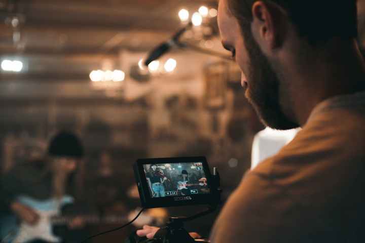 man recording video